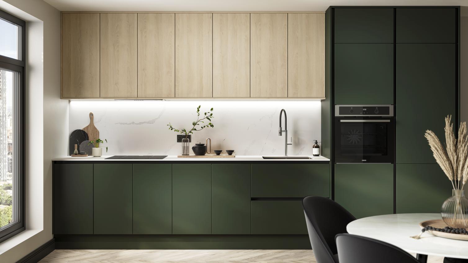 A single-wall kitchen with green cabinets. Includes a white worktop, induction hob, and oak wall cabinets.